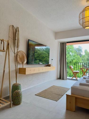 a bedroom with a bed and a large mirror at Rue Rooms in Fethiye