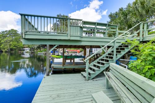 a bridge over a body of water with a dock at Boathouse and Dock Riverfront Dunnellon Getaway! in Dunnellon