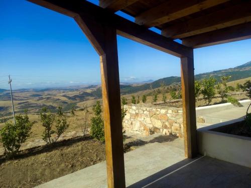 a view from the porch of a house with a view at MonteSoprano Agriturismo - Resort - Spa - Gym -Camping - Suite in Capizzi