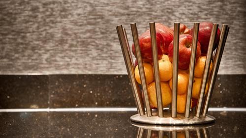 a bird in a bird stand on a table at Days Inn by Wyndham Englewood Dayton Airport in Dayton