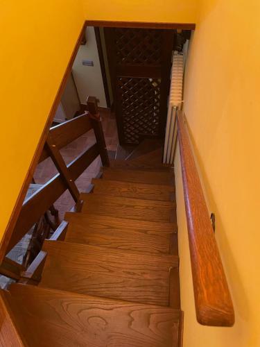 an overhead view of a stairway with wooden stairs at 18th Century Samnium Stone Residence in Alfedena