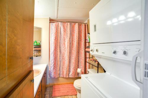 a small bathroom with a toilet and a sink at Waterloo Home Walk to Pickwick Lake Fishing Pier! in Waterloo