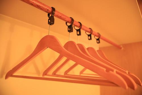 a red hanger with hooks in a room at Roka Hotel Boutique in Boa Vista