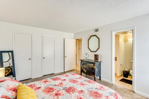 a bedroom with a bed and a dresser and a mirror at Dallas Condo in Walkable Knox Street District! in Dallas