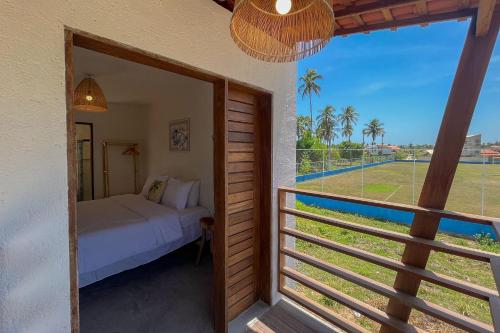 Postel nebo postele na pokoji v ubytování Casa Brise Seu Refúgio Tropical Nobile Stays