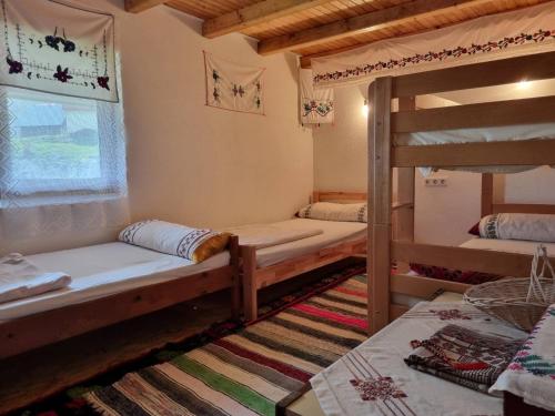 a room with two bunk beds and a window at Kapija Lukomira in Konjic