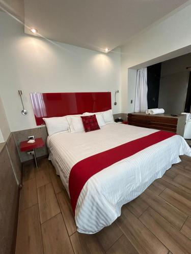 Postel nebo postele na pokoji v ubytování Zújmú Business Boutique Hotel