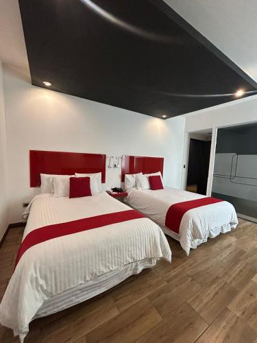 Postel nebo postele na pokoji v ubytování Zújmú Business Boutique Hotel