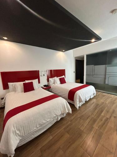 Postel nebo postele na pokoji v ubytování Zújmú Business Boutique Hotel