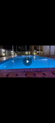 La alberca dentro o cerca de فيلا جرين بيتش