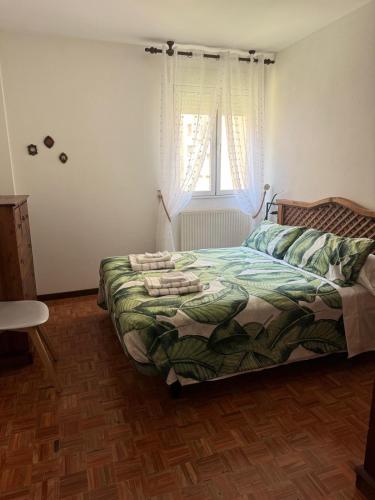 a bedroom with a bed and a window at Origen HARO paternina in Haro