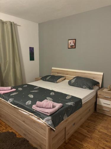 a bedroom with a bed with two towels on it at Apartments with parking space Jelsa, Hvar - 4040 in Jelsa