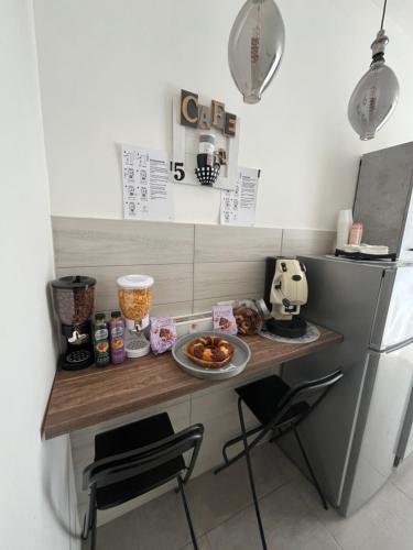 a kitchen with a counter with food on it at Mamì B&B in Naples