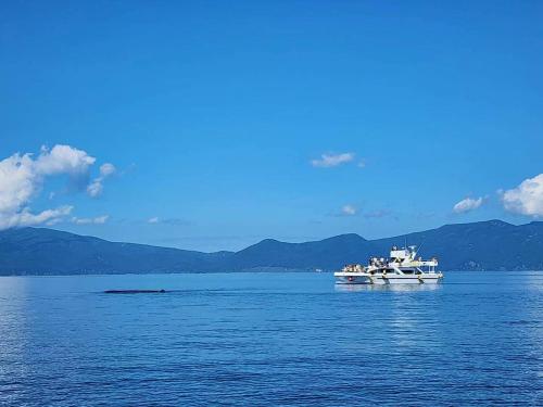 a boat floating on a large body of water at Crea House in Sapporo
