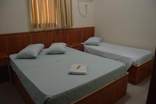 Tempat tidur dalam kamar di Hotel Congonhas