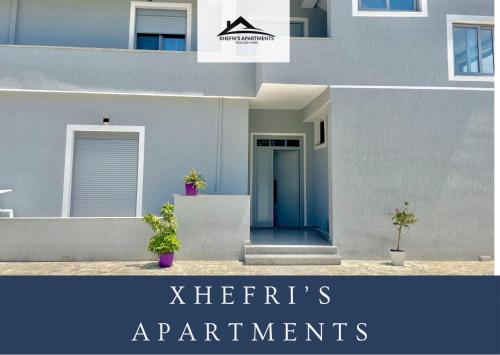 a rendering of a house with the words herberts apartments at Xhefri's Apartments in Vlorë