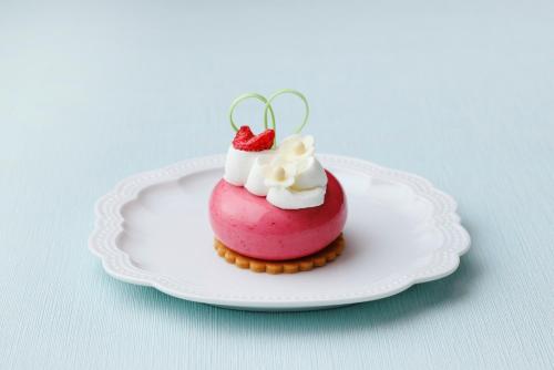 a pink dessert with a cherry on top on a plate at ANA Crowne Plaza Kobe by IHG in Kobe