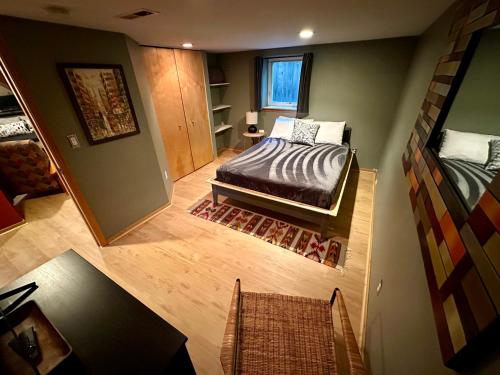 an overhead view of a bedroom with a bed and a window at Cozy PDX Hideout, Ideal Location in Portland