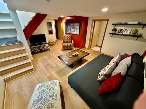 a living room with a couch and a table at Cozy PDX Hideout, Ideal Location in Portland