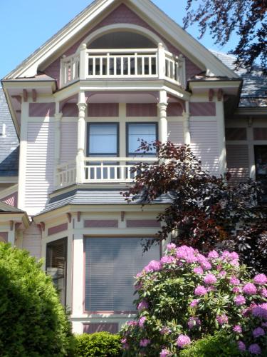 a large house with a balcony on top of it at 254 South Union Street Guest House in Burlington