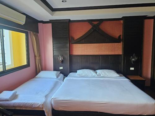 Cama o camas de una habitación en Nanai 2 Residence Patong Phuket