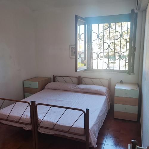 Ένα ή περισσότερα κρεβάτια σε δωμάτιο στο Villa M