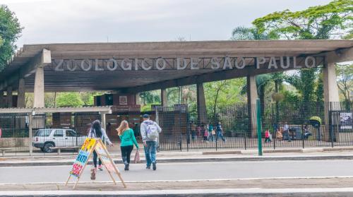 a group of people walking in front of a park at Hotel Congonhas in Sao Paulo