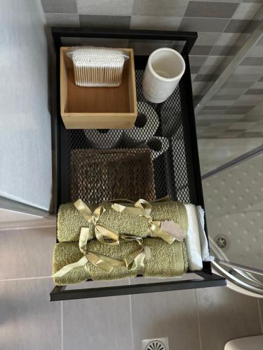 a box filled with different types of towels at Melina house in Ayiá