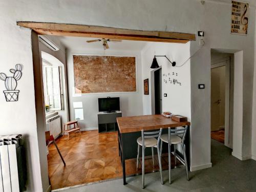a kitchen with a table and chairs in a room at Saint Jack Luxury in Trieste