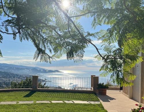 a view of the ocean from the backyard of a house at La Casa di Pucci Sanremo in Sanremo