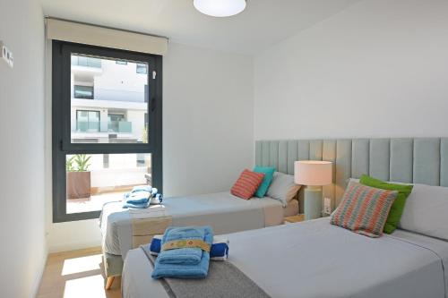 Ένα ή περισσότερα κρεβάτια σε δωμάτιο στο Allonbay Mediterranean Apartments by NRAS