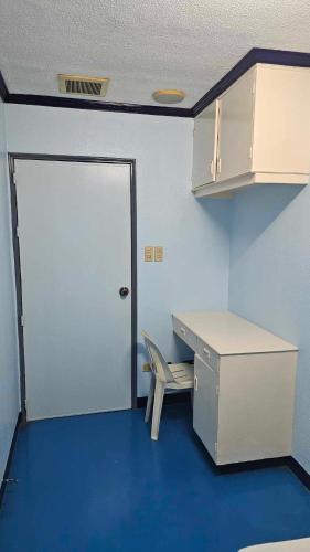 an empty office with a desk and a chair at Green Mellow Court in Dipolog