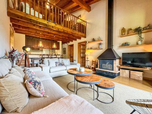 a living room with a couch and a fireplace at La Maison du Fleuve in Ur