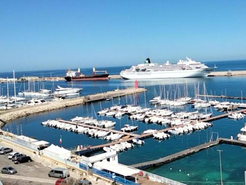 a harbor with a cruise ship in the water at B&B "La Vista Preziosa" Rooms in Gallipoli