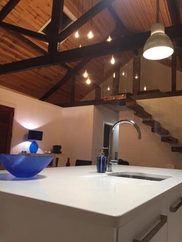 a kitchen with a sink and a bowl on a counter at Loft beach in Vieira de Leiria