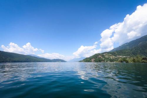 a large body of water with mountains in the background at Appartements Dürnle in Mühldorf
