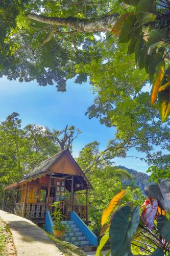 a gazebo in a park with trees at The Dusun in Seremban