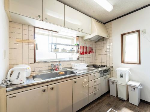 Kuchyň nebo kuchyňský kout v ubytování Ocean villa 大洗
