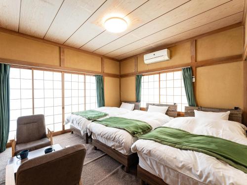 Postel nebo postele na pokoji v ubytování Ocean villa 大洗