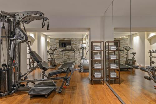 a gym with treadmills and elliptical machines at VISIONAPARTMENTS Brandschenkestrasse - contactless check-in in Zürich