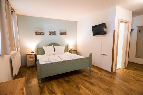 Ένα ή περισσότερα κρεβάτια σε δωμάτιο στο Grand Apartments Špindlerův Mlýn