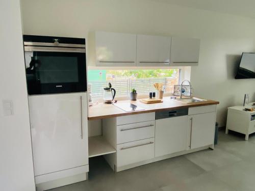 Kuchyň nebo kuchyňský kout v ubytování Ferienwohnung Bootsmann Zirchow auf Usedom