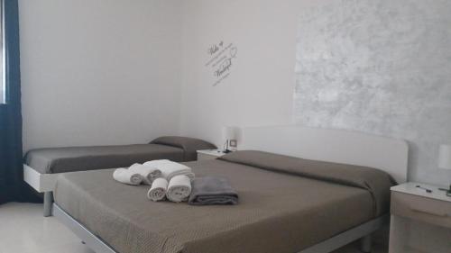 Postel nebo postele na pokoji v ubytování B&B Le perle fg