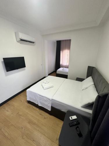 Postel nebo postele na pokoji v ubytování Davidson Boutique Hotel