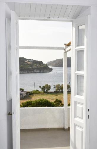 an open door with a view of the ocean at Sapsila Patmos Residences in Sapsila