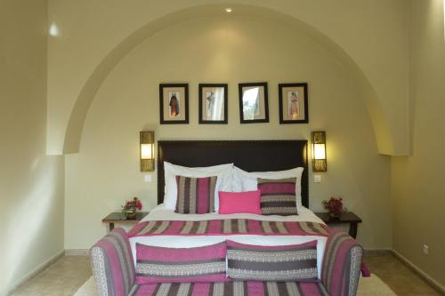 Katil atau katil-katil dalam bilik di Le Clos des Oliviers