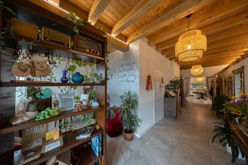 a room with a hallway with plants on the walls at Agriturismo Sadira in Calusco dʼAdda