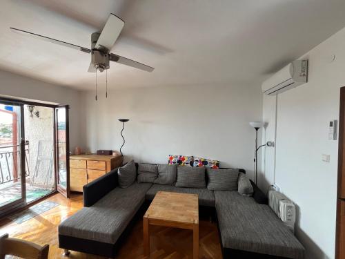 a living room with a couch and a table at Adriatic View in Pješčana Uvala 