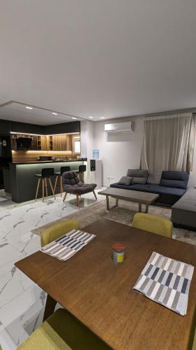 a living room with a couch and a table at New Cairo Serviced Apartment in Cairo