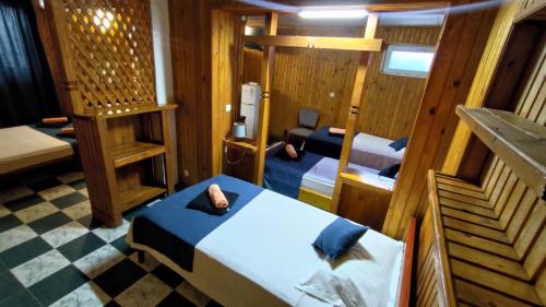 a small room with a bed and a table in it at Holiday House Costinesti in Costinesti